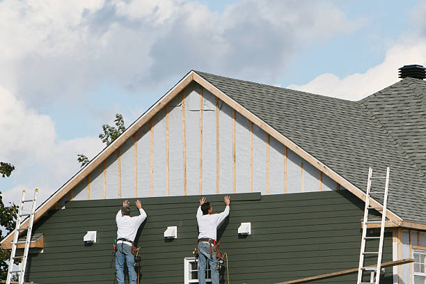 Professional Siding Installation technician working in Harrisville, WV